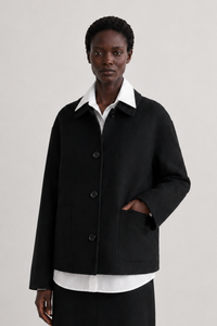 Simone Carter (5'10.5" / 179 cm) wears a size S