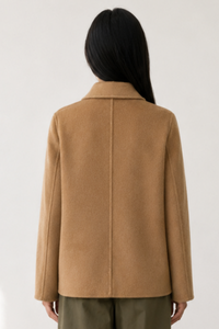 June Park (5'9.5" / 177 cm) wears a size S