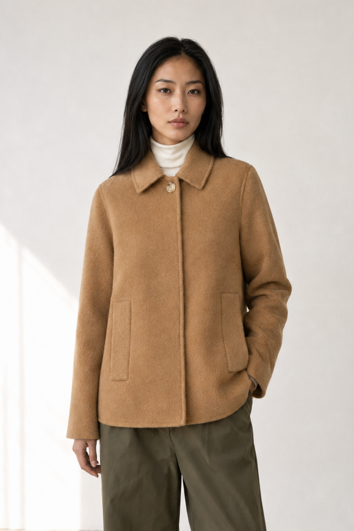 June Park (5'9.5" / 177 cm) wears a size S